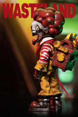 Alt text: Wasteland-Crazy Clown-Mac toy figure preorder, limited edition resin, 8.7cm tall, holding a metal box.