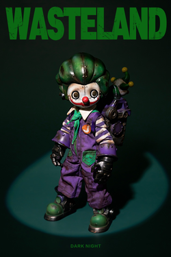 Wasteland-Crazy Clown-Joker toy in purple overalls with accessories, available for preorder. Limited edition of 499 sets, ships March 2025.