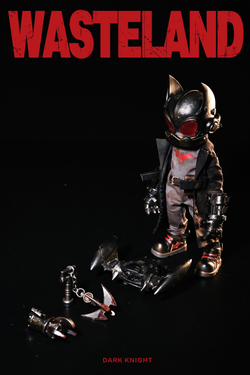 Alt text: Limited edition Wasteland-Dark Night-Black toy figure in helmet, armor, and mask, with battery-powered light, preorder for March 2025.