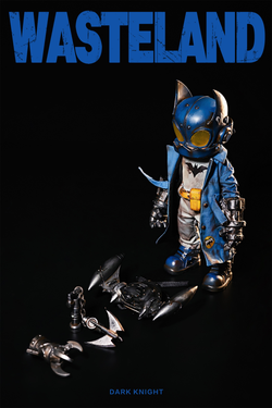 Alt text: Wasteland-Dark Night-Blue toy figure with yellow eyes, blue coat, and helmet, preorder for March 2025.