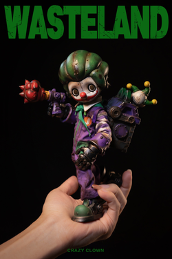 A hand holding the Wasteland-Crazy Clown-Joker action figure, featuring a detailed clown face and accessories, available for preorder.