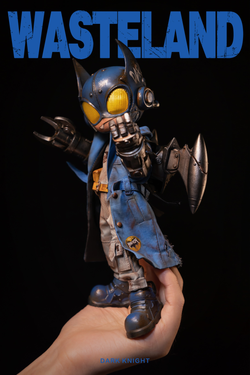 Hand holding the 8-inch Wasteland-Dark Night-Blue toy figurine, featuring a battery-powered light-up head, available for preorder, shipping March 2025.