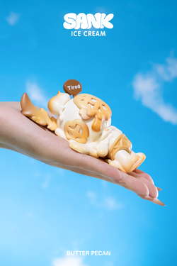 Hand holding the Sank-Ice Cream toy by Sank, featuring a limited-edition resin figure set including one Sank, one boy, and a coffee cup handle.