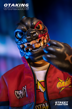 Toy figure in red jacket and black mask, close-up of logo and zipper, OTAKING - Street fighter.