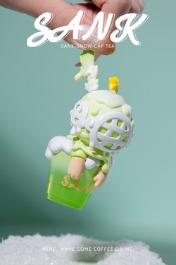 A blind box and art toy store presents Sank-Snow cap tea - Preorder. Toy in the air, close-up of toy with cartoon character, resin material, limited edition. Size: 4cm*5.1cm*8.8cm.