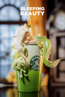 Statue of a mermaid on a coffee cup, Sleeping Beauty-Coffee Fairies-Latte - Preorder, close-up of mug.