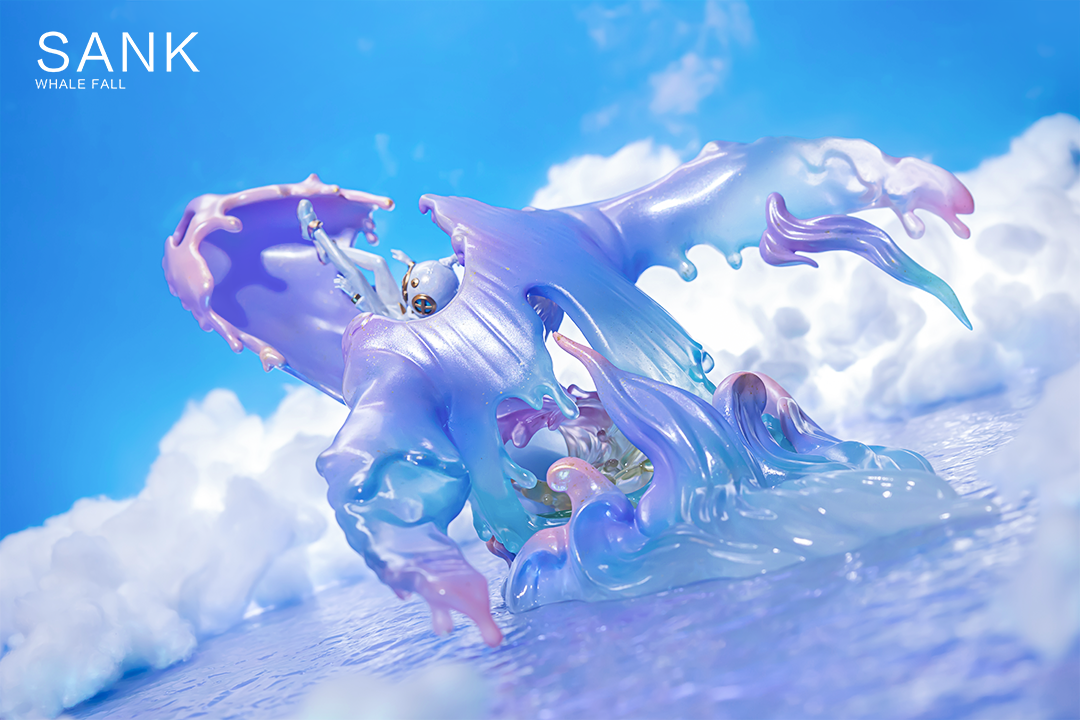 A blind box and art toy store presents Sank-Whale Fall-Moon River. Toy figure with wings in the air, purple and blue liquid, and oversized resin design. Preorder now for Oct 2024.