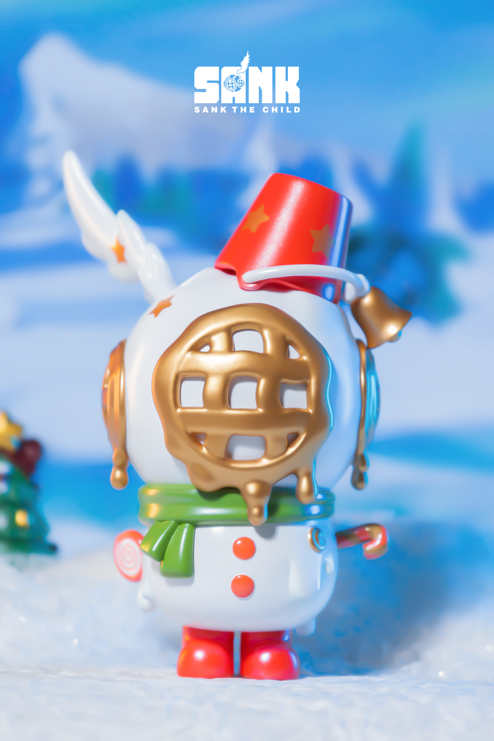 Sank - Snowman - White: Snowman toy with a gold circle, red bucket, and unique details.