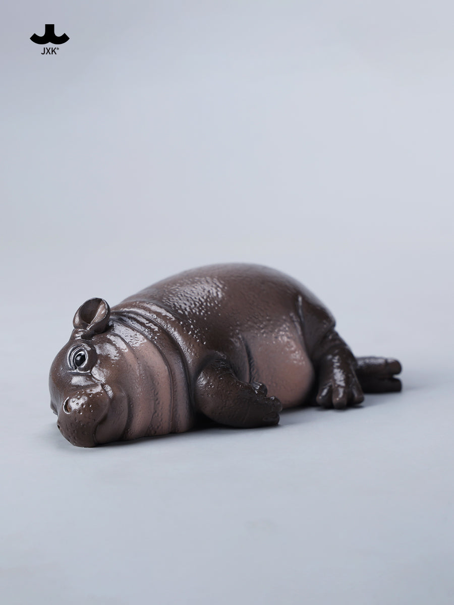 JXK-Baby Hippopotamus Figurine MooDeng 3, resin pufferfish ice cream-themed collectible, depicting a small hippo lying on its back. Preorder for April 2025.