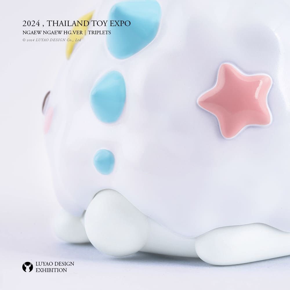 Ngaew Ngaew - Triplets - White toy with blue and pink stars, resembling a cartoon piggy bank, made of vinyl, approximately 6.8cm tall.