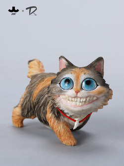 Urban Legends-Grinning Cat Figurine, featuring a large smile and detailed eyes, crafted from resin. Includes bone pendant necklace, available for preorder at Strangecat Toys.