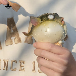 JXK-Pufferfish Ice Cream Figurine held in hand, shaped like a fish cone, includes a resin spoon. Preorder for April 2025.