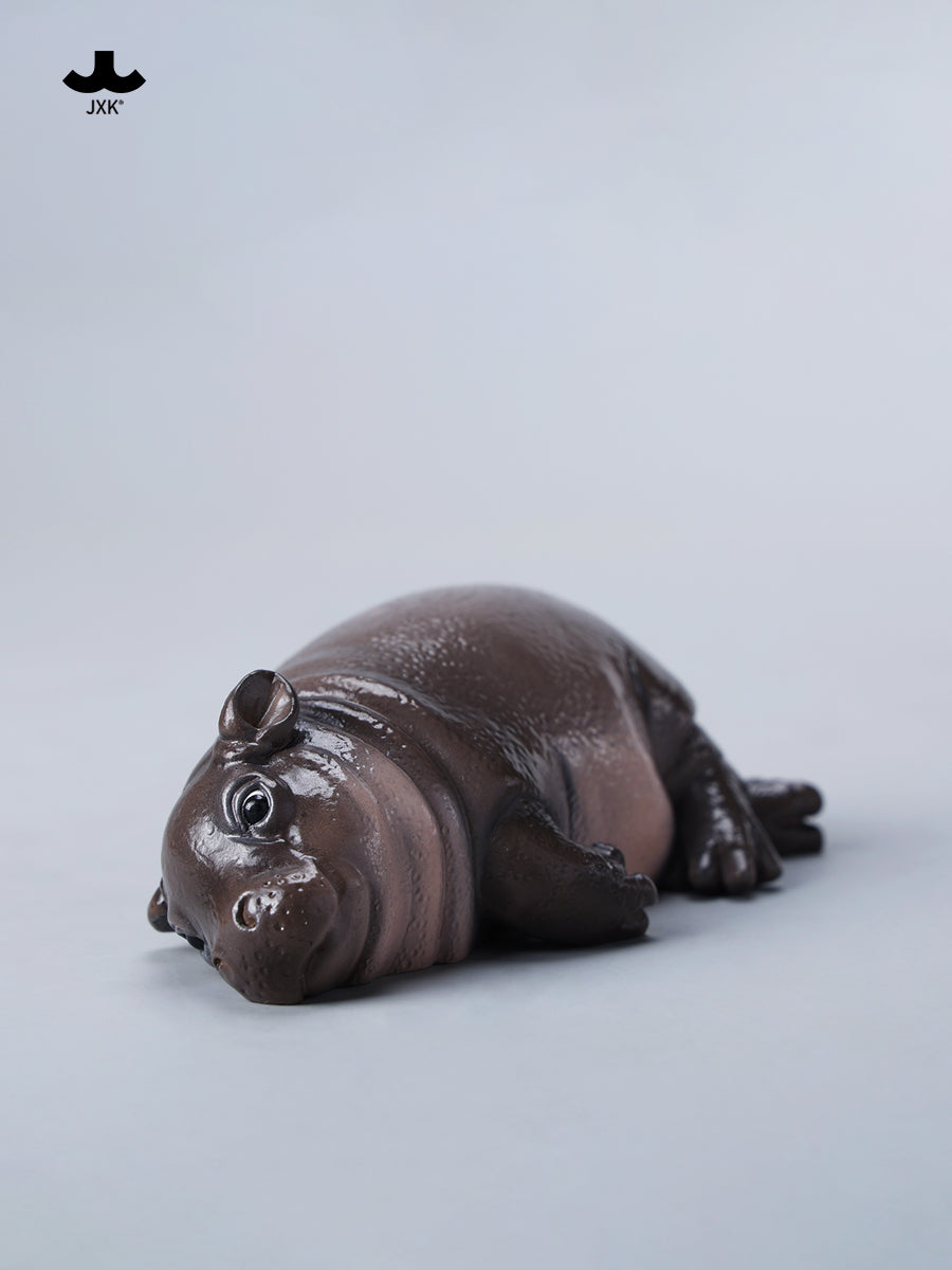 JXK-Baby Hippopotamus Figurine- MooDeng 3, a resin pufferfish ice cream-themed toy, shown lying on its back, preorder for April 2025.