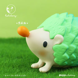 Toy hedgehog figurine on grass from the Good Hedgehog and Bad Hedgehog Blind Box Series by Fufufanny. Preorder for Q4 2024.