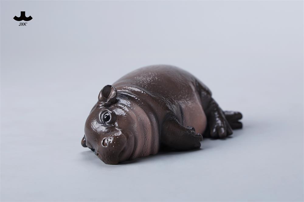 JXK-Baby Hippopotamus Figurine- MooDeng 3, a resin collectible, features a detailed hippo design, including a close-up view of the eye and foot.