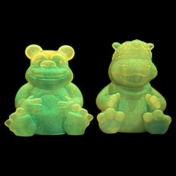 Two green animal figurines, a hippo and a bear, from the High Spirits - Gumbearto and Hippie Pam Set by Fett Up Toys.