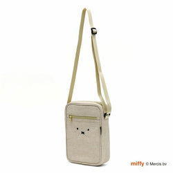 A whimsical Miffy shoulder bag with a charming face design. Perfect for adding a touch of fun to your bag or pouch. Dimensions: H7 x W4 x D1.8cm.