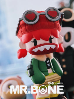 MR.BONE Blind Box Wild One Series toy, featuring a cartoon face with red hair and a hat, part of a collectible art toy series.