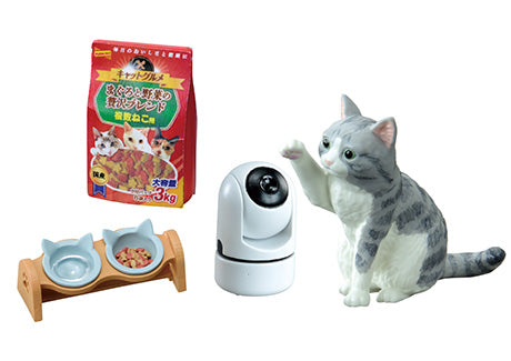 A cat toy, cat figurine, and cat-shaped bowls in the Life With Cats Re-ment Blind Box Series from Strangecat Toys. Purchase a case for all 8 designs.