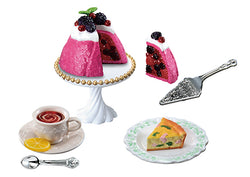 My Secret Tea Time Re-ment Blind Box Series, featuring assorted dessert miniatures, including a pink cake with fruit and a slice of pie on plates.