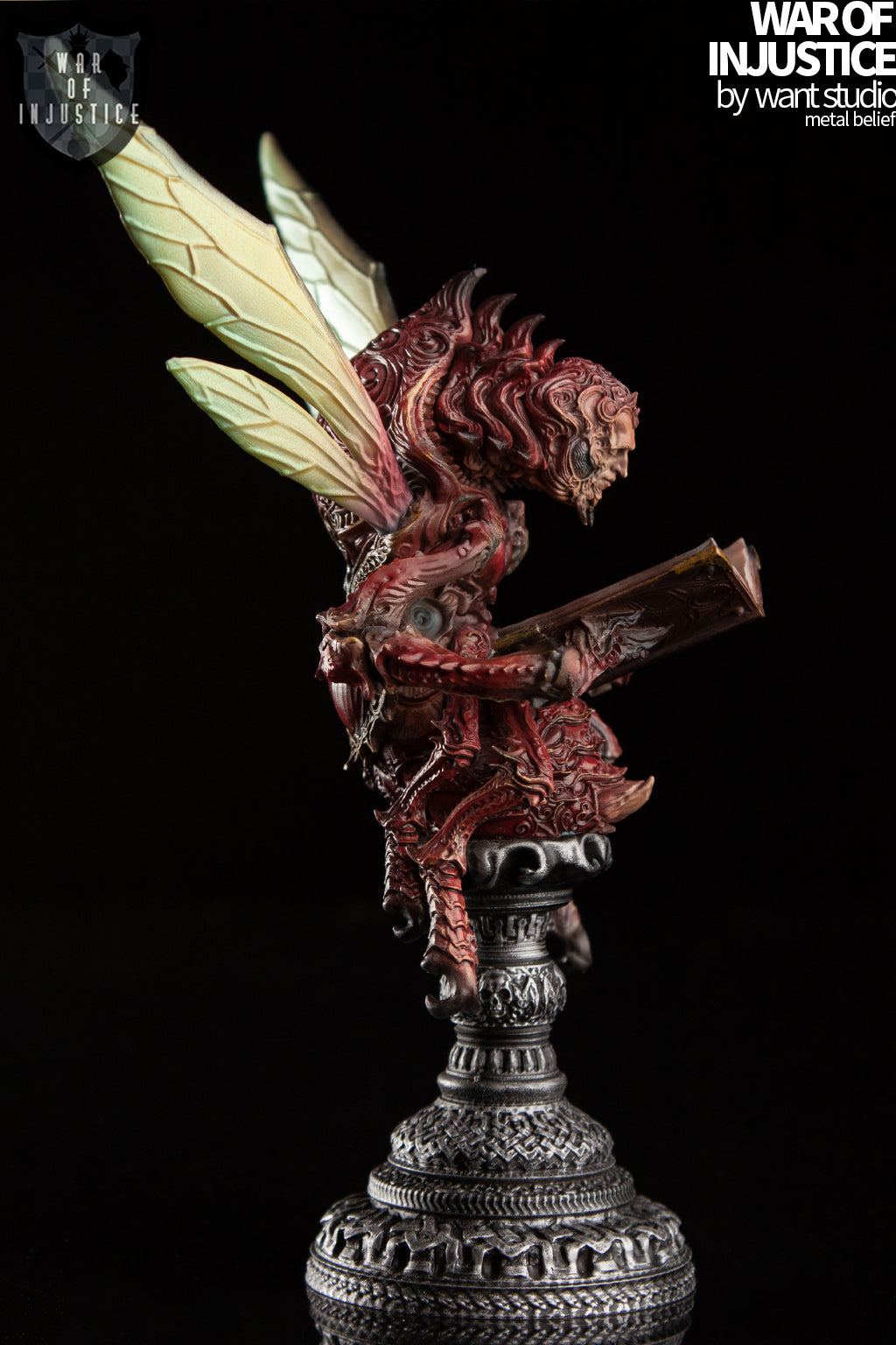 A statue of a creature reading a book, part of the War of Injustice-Chess-Red Bishop collection.