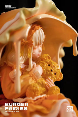 Statue of a girl holding a teddy bear, part of The Sleeping Beauty-Burger Fairies-Yellow, limited resin edition from Strangecat Toys.