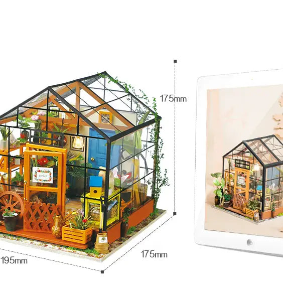 A miniature greenhouse with plants, a glass roof, and a window. Robotime-Rolife Sam's Study DG102 dollhouse library with shelves, books, and frames. From Strangecat Toys.