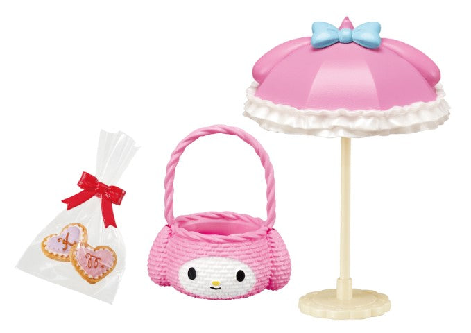 My Melody Kuromi Sweet Tea Party Re-ment Blind Box Series featuring a pink umbrella, basket, and hat from Strangecat Toys.