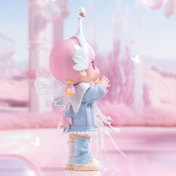 MOLLY Metamorphose into Swan Action Figure, a toy doll with wings and swan headband, close-up details of doll's legs and baby boot.