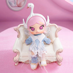 MOLLY Metamorphose into Swan Action Figure sitting on a chair, close-up of doll's face and eye, with wings and dress, 5.12 inches tall.