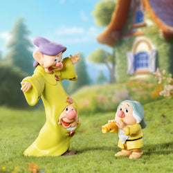 Toy figurines from the Disney Snow White Classic Blind Box Series displayed on grass. Preorder now, ships late July 2024.