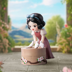 Alt text: Disney Snow White Classic Blind Box Series toy figurine of a girl on a box, available for preorder at Strangecat Toys.