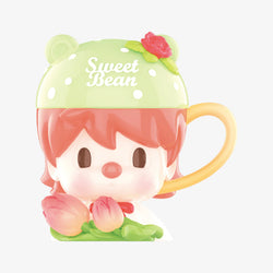 A toy mug with a face and flowers from the Sweet Bean Afternoon Tea Blind Box Series by Strangecat Toys.