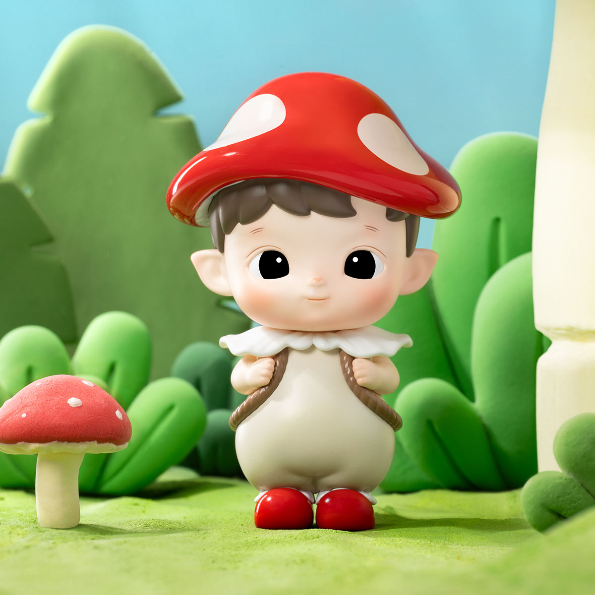 A blind box toy series, HACIPUPU Adventures In The Woods Box, featuring a boy figurine in a mushroom garment. Includes 12 regular designs and 1 secret.