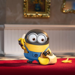 Universal Despicable Me 4 Blind Box Series toy figurine of a cartoon character holding a banana, available for preorder. Ships Late July 2024.