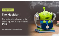 Toy figurine of a green alien with headphones, part of the Disney/Pixar Alien-Immersive Experience Blind Box Series.