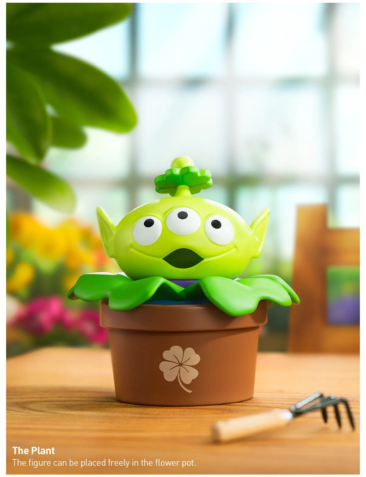 Disney/Pixar Alien-Immersive Experience Blind Box Series featuring a toy alien in a pot with clover designs.