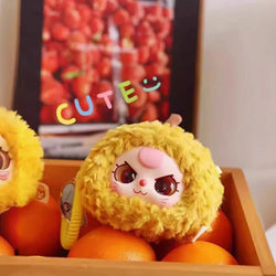 Baby Three Fruit Orchard Plush Series Blind Box featuring a mix of oranges and stuffed animals. Preorder for a chance at 8 unique plush designs.