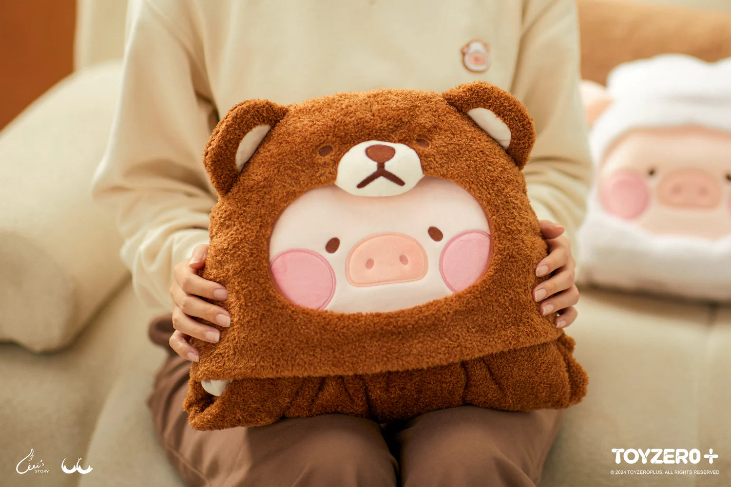 A person holding a LuLu the Piggy Costume Series photocard holder keyring, a plush toy for comfort, from Strangecat Toys.