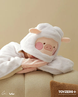 A person holding LuLu the Piggy Costume Series - Blanket with Hat, a cozy companion from Strangecat Toys. Size: 9.5 cm x 17.5 cm. Preorder now for late June 2024.