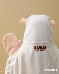 A person in a white robe with a sheep garment and plush animal head, holding LuLu the Piggy Costume Series - Photocard Holder Keyring. From Strangecat Toys, a blind box and art toy store.