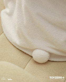 A close-up of LuLu the Piggy Costume Series - Blanket with Hat, featuring a white pom on a blanket. Product highlights include a photocard holder keyring. Ideal for comfort seekers.