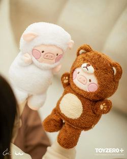 A hand holds LuLu the Piggy Costume Series - Fluffy Hand Puppets, featuring Bear LuLu and Sheep LuLu in cute outfits with magnet hands. Ideal for comfort seekers.