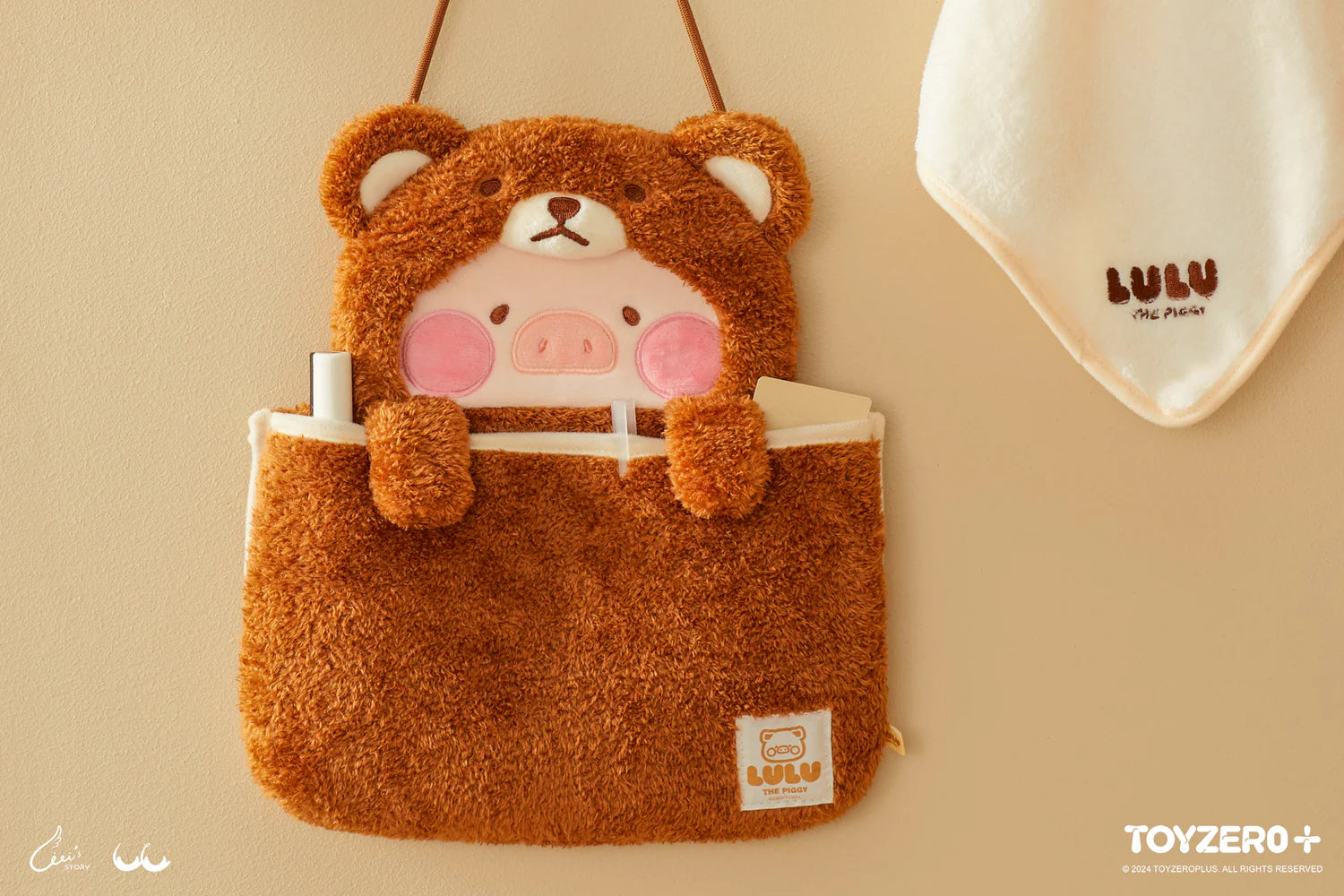 A fluffy reversible wall bag from the LULU THE PIGGY COSTUME SERIES, featuring Bear LuLu and Sheep LuLu designs. Perfect for comfort-seeking adults. Size: 25 cm x 25 cm. Preorder - Ships Late June 2024.