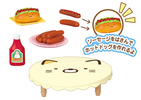 A blind box set featuring Sumikkogurashi Home Party Re-ment designs: hot dogs, ketchup, sausages, taco, and a cartoon cat face. From Strangecat Toys.