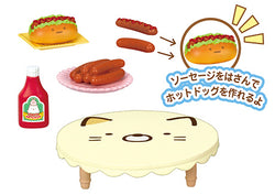 A blind box set featuring Sumikkogurashi Home Party Re-ment designs: hot dogs, ketchup, sausages, taco, and a cartoon cat face. From Strangecat Toys.