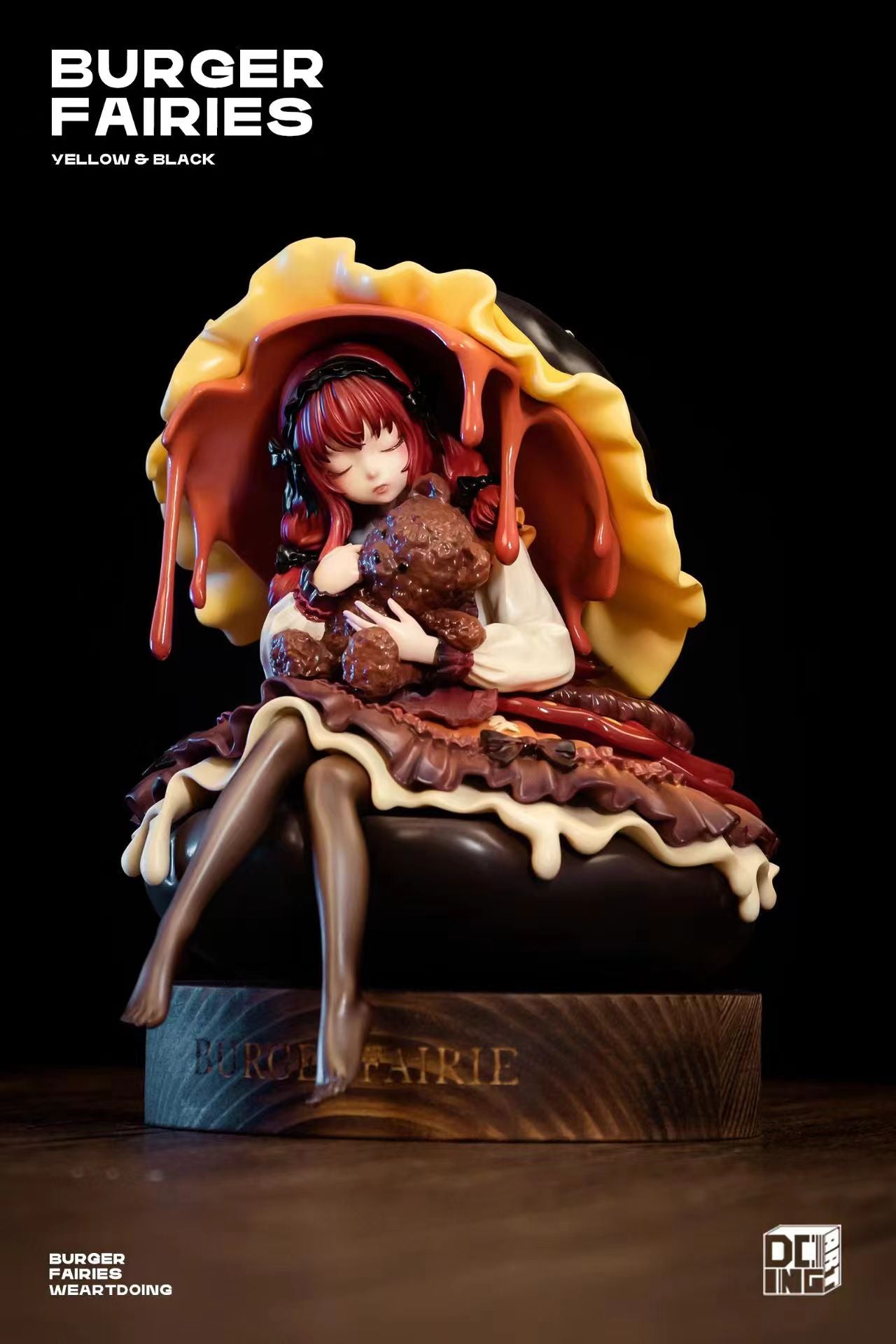 Statue of a girl holding a teddy bear, part of The Sleeping Beauty-Burger Fairies-Black limited edition resin set with wooden base.