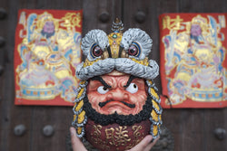 Daruma Doll-Lion Dance-Yellow statue, held in hand, features a detailed human face with crown. Limited edition resin art toy for preorder, 25cm tall.