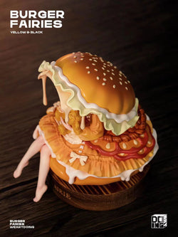 The Sleeping Beauty-Burger Fairies-Yellow: A whimsical resin toy of a burger with legs, featuring a seated figure, on a wooden base.