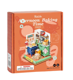 A toy kitchen DIY crafting kit titled Afternoon Baking Time Mini Diy House from Strangecat Toys. Includes stove, oven, cabinet, and more for creative decorating. Dimensions: 5.9 x 5.3 x 2.1 in.